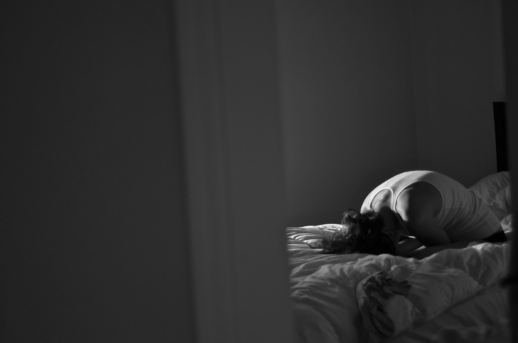 Stressed and depressed person in room